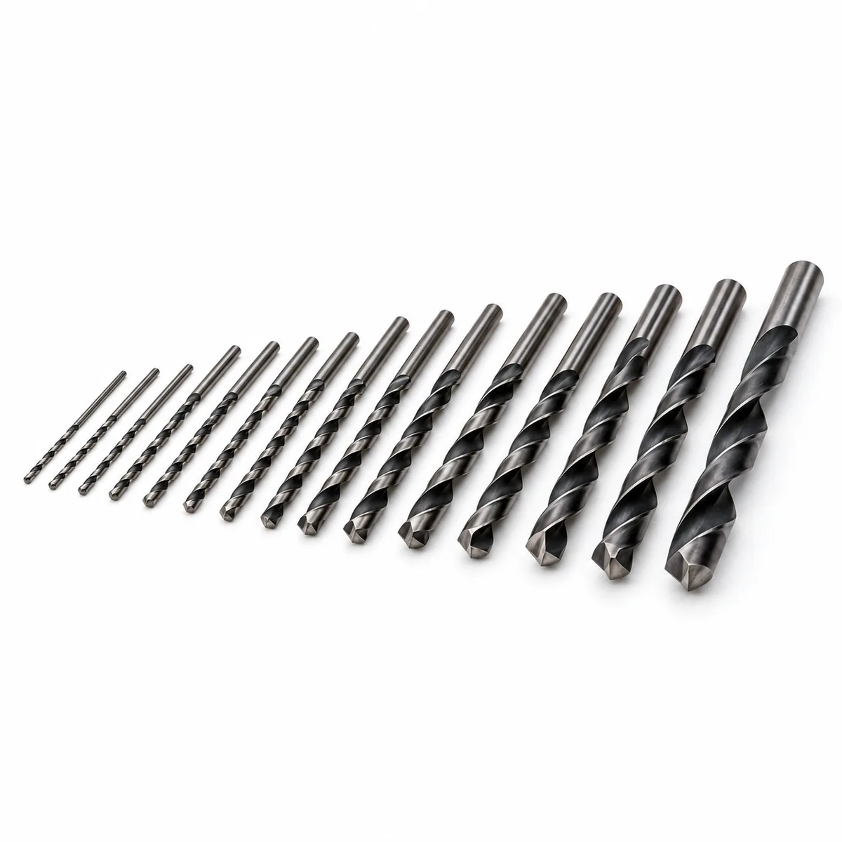 Dormer Original metric and inch twist drill bits arranged by size on a white background